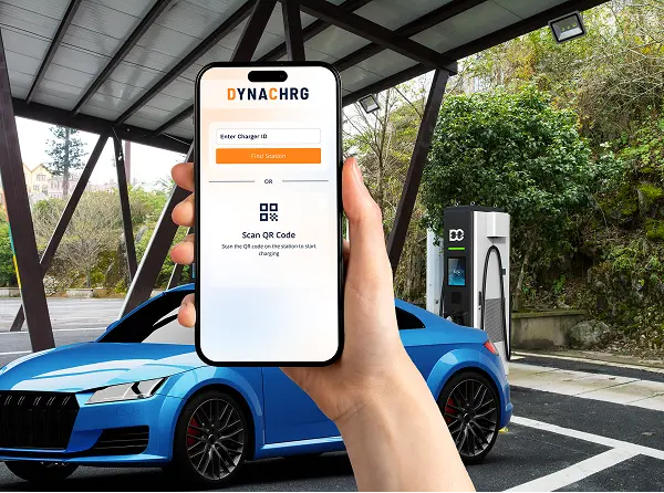 Hand holding smartphone displaying DYNACHRG app interface for locating and scanning QR code to start EV charging, with blue electric car and charging station in background.