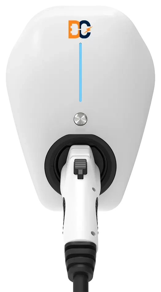 Top view of a white electric vehicle charging connector plugged into a charging station with DC logo.