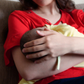 Mother holding her child at home