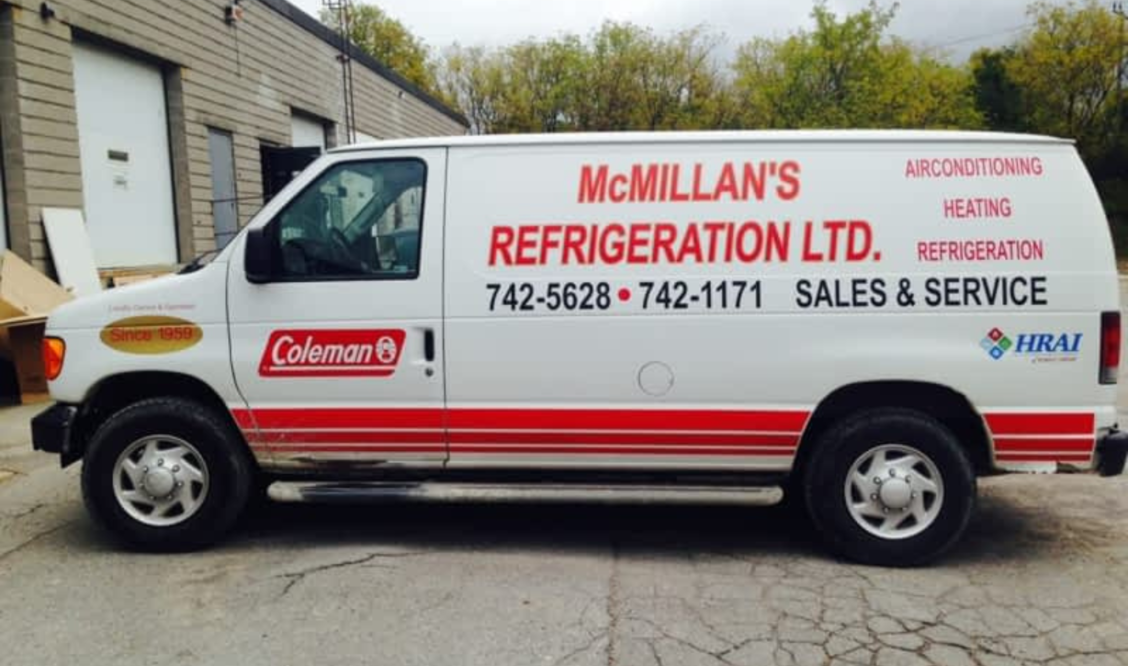 White service van with red stripes for McMillan's Refrigeration Ltd. promoting air conditioning, heating, refrigeration sales and service with phone numbers and Coleman and HRAI logos.