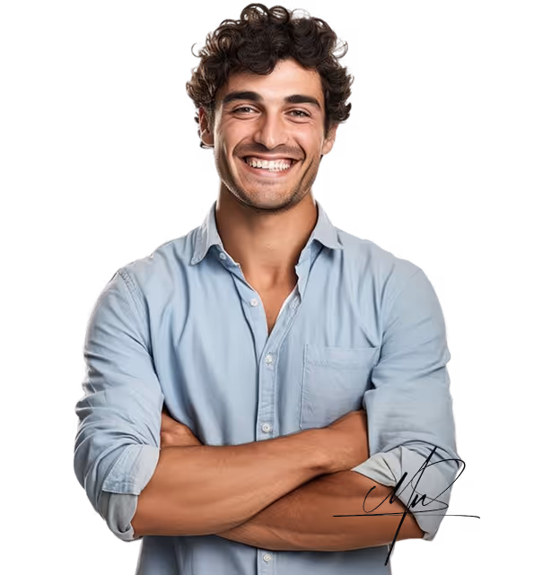 Smiling man with curly hair wearing a light blue shirt with arms crossed.