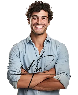 Smiling man with curly hair wearing a light blue button-up shirt and arms crossed.