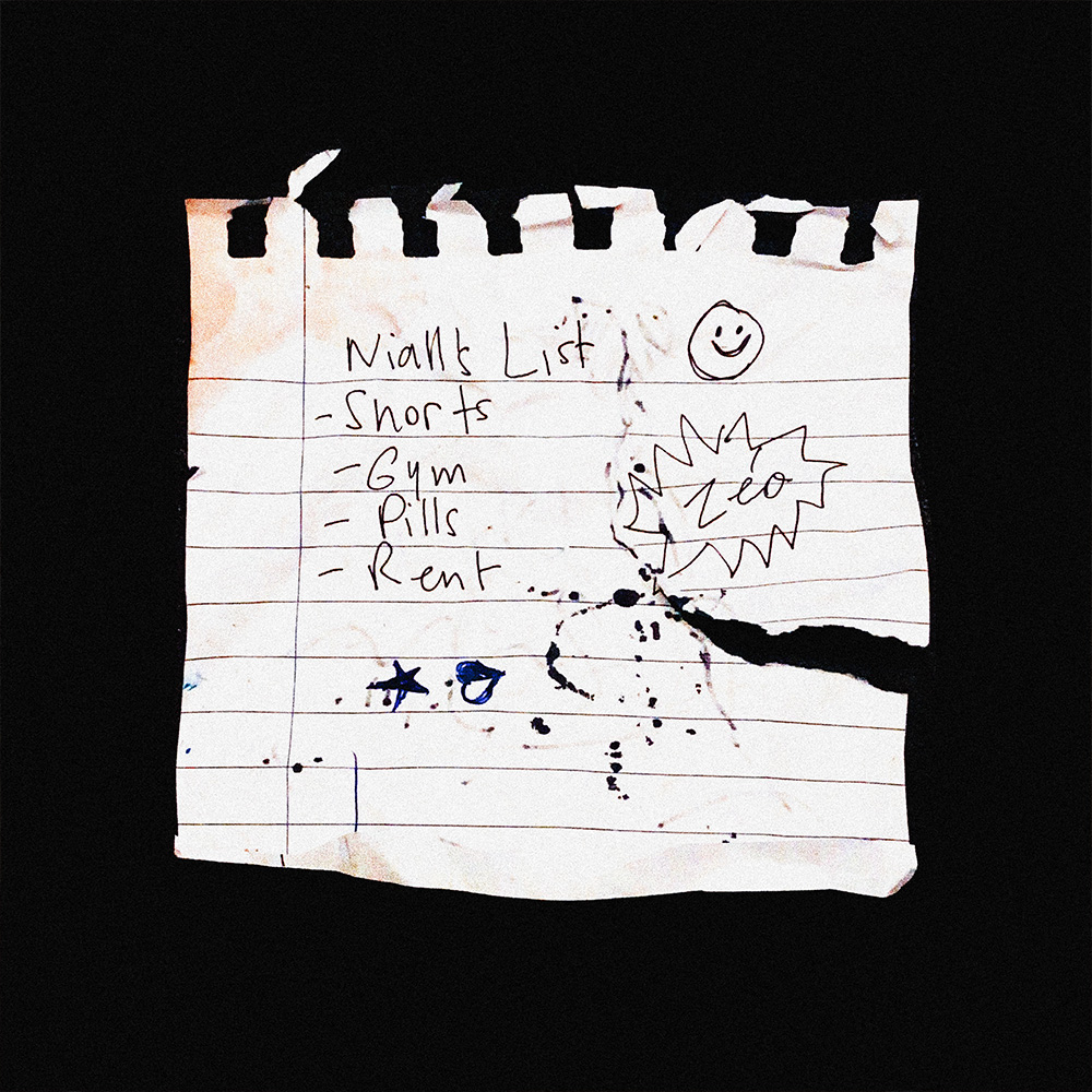 Torn notebook page with handwritten list: shorts, gym, pills, rent, with doodles and ink stains.
