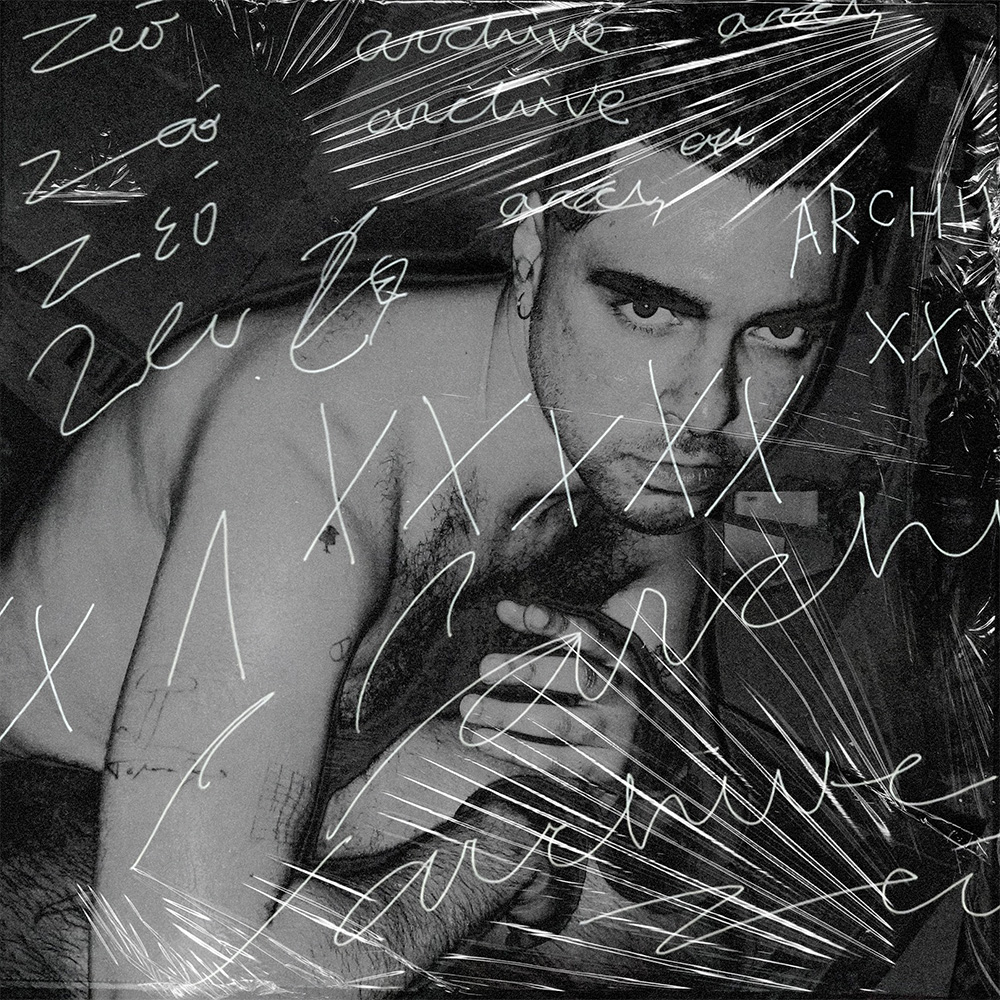 Black and white photo of a shirtless man with handwritten white scribbles and words overlayed.