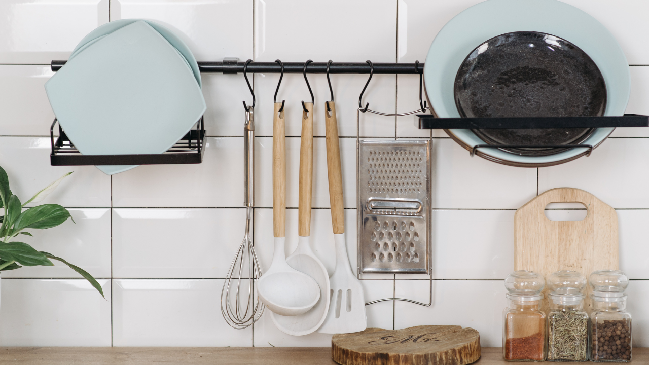 Alt text: Kitchen utensils, plates, a cutting board, and spice jars.