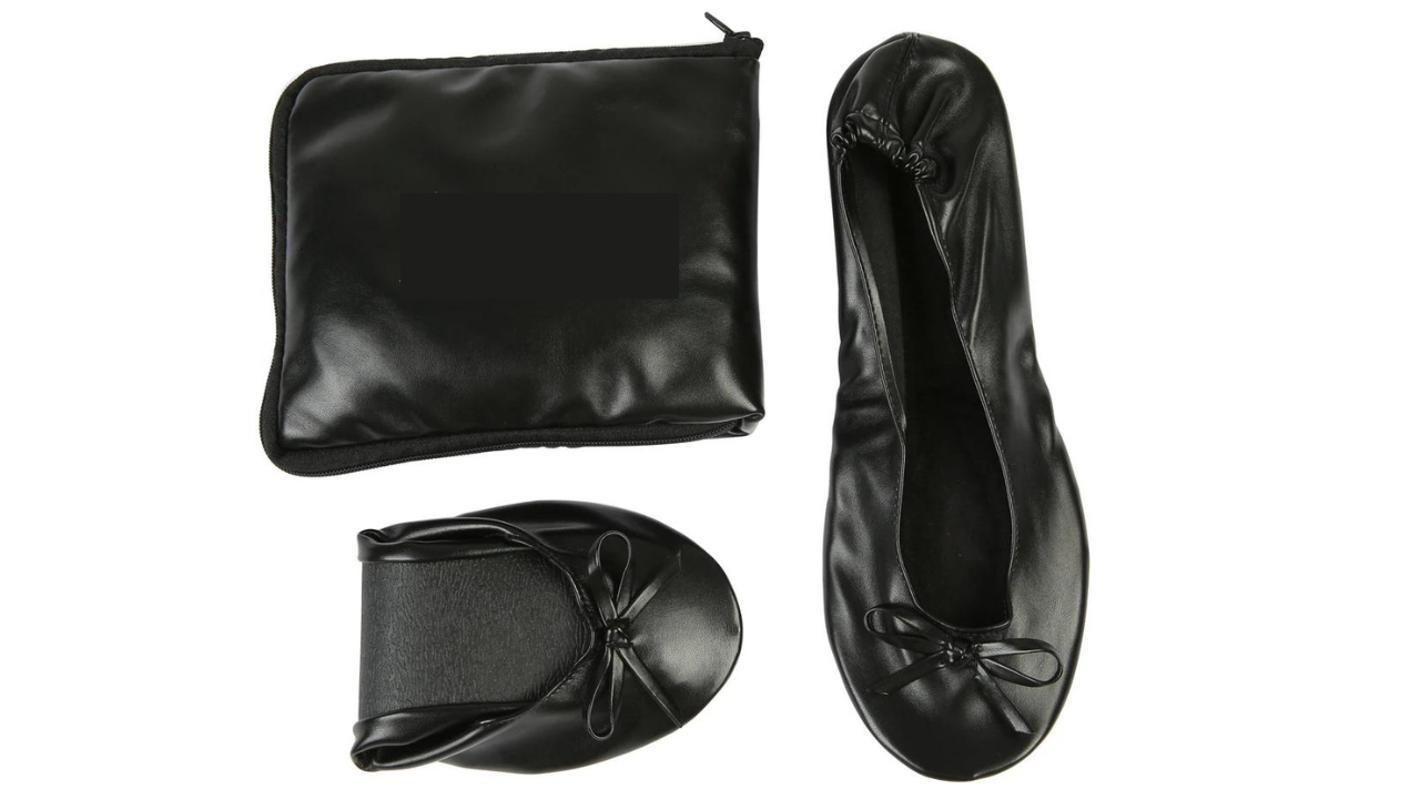 Black folding ballet flats shown beside their zippered pouch
