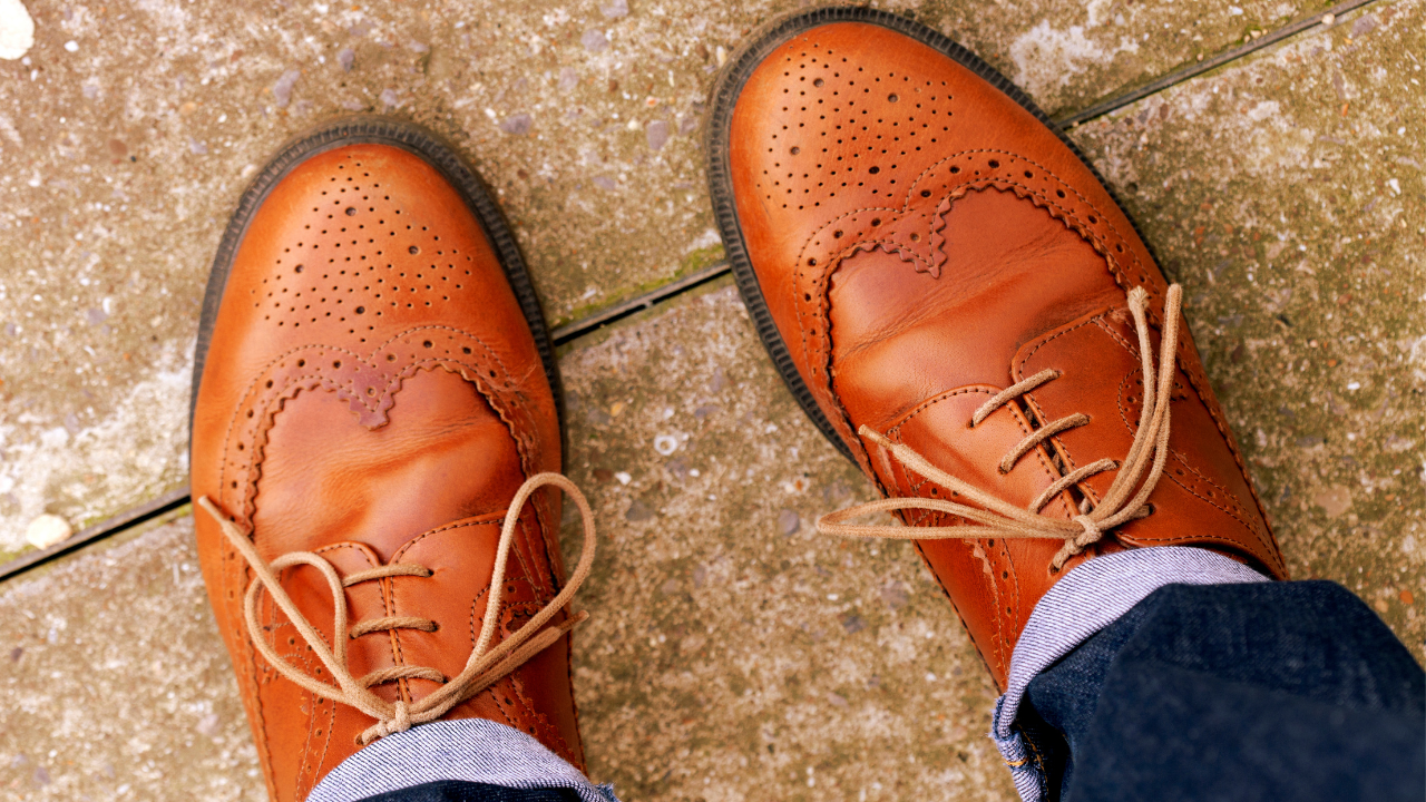 Pair of tan leather brogues with decorative perforations