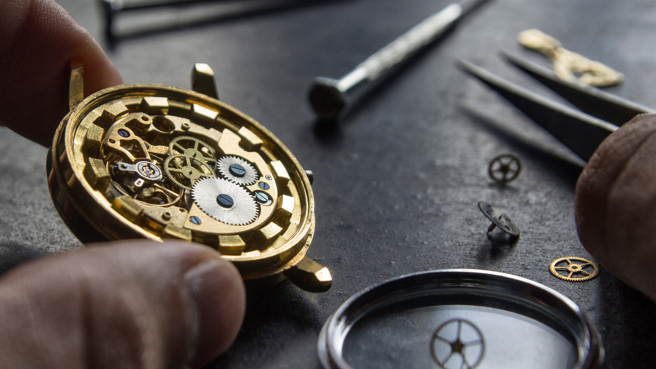 Watch repair tools arranged inside a portable kit