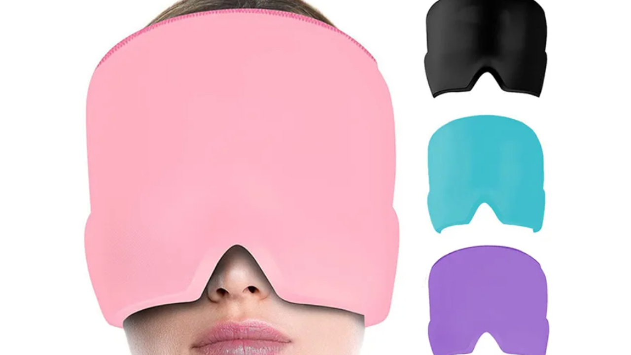 A person wearing a pink gel head wrap with black, blue, and purple variants beside it