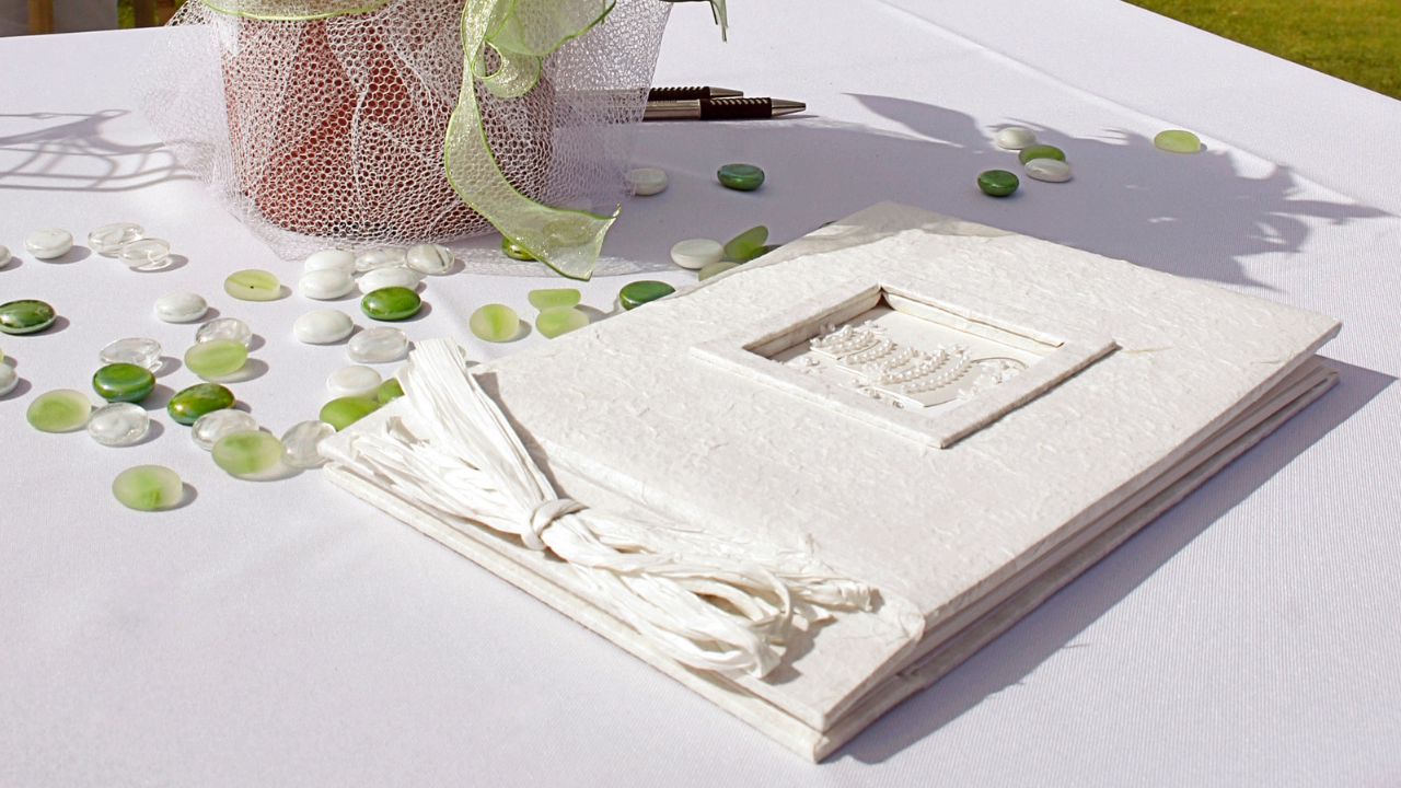 White textured guest book on a decorated event table