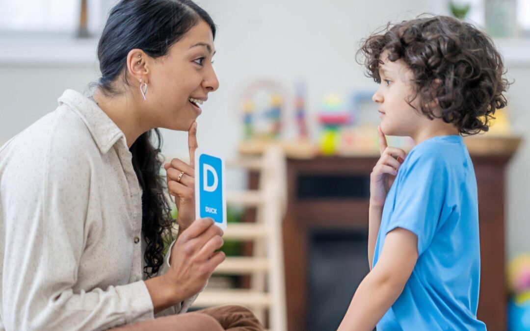 Parent and child working with a licensed speech therapist during an in-home session in Greater Boston