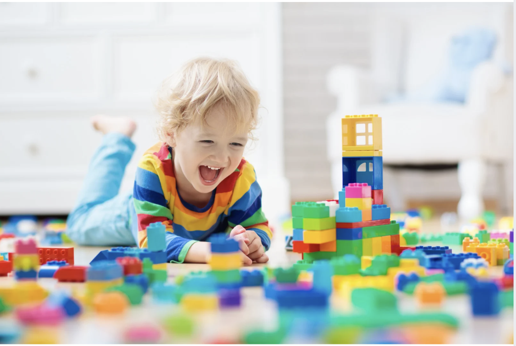 Licensed speech therapist working with a young child during an in-home session in Greater Boston