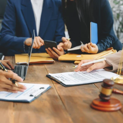 Lawyers Sat Around Table discussing Planning Appeals