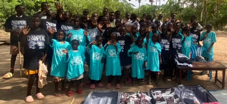 John Mwase and the children of Transform the Needy Child