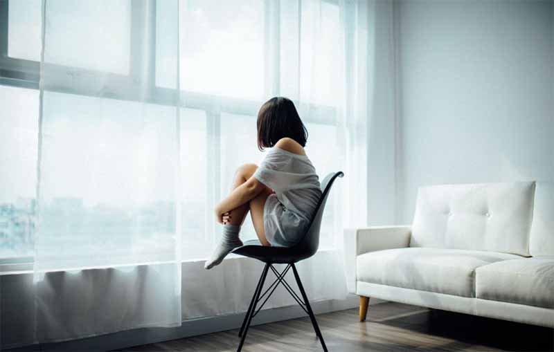picture of woman thinking about options after IUI cost analysis