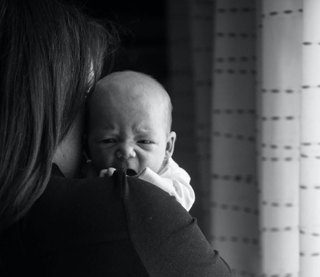 Picture of mother and baby bonding during FMLA maternity leave