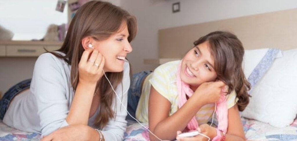 image of mom and daughter listening to podcast