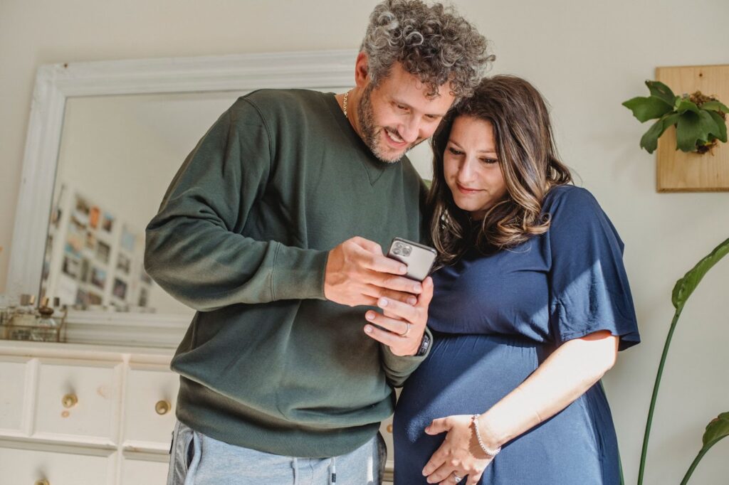 image of parents looking at phone