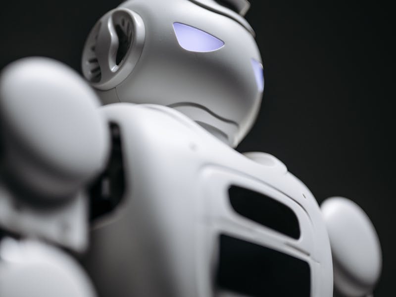 Unitree G1 humanoid robot profile view dark background