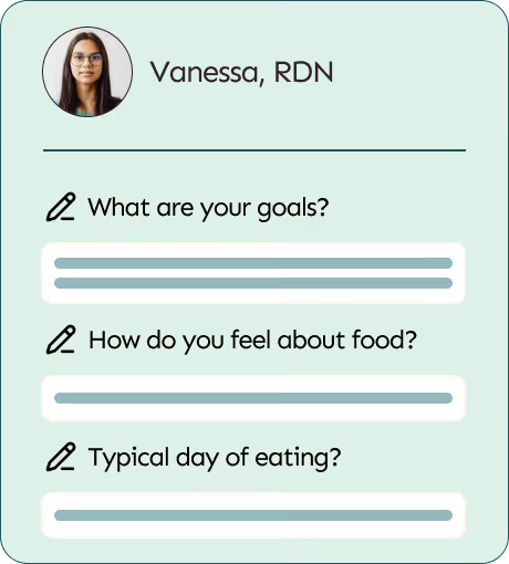 Smiling woman with curly hair using a laptop in a kitchen with a floating chat box from Vanessa, RDN asking about goals, feelings about food, and typical day of eating.