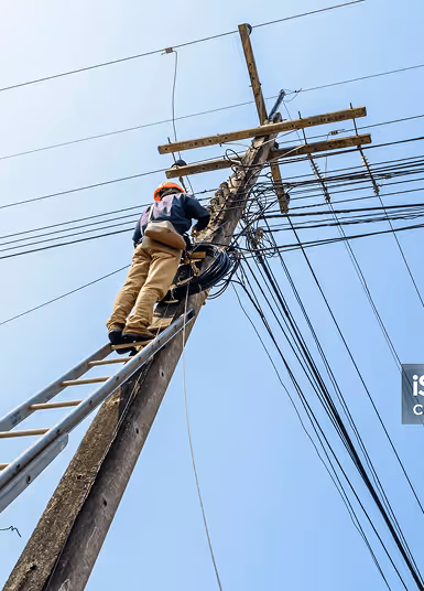 Man working on telephone pole