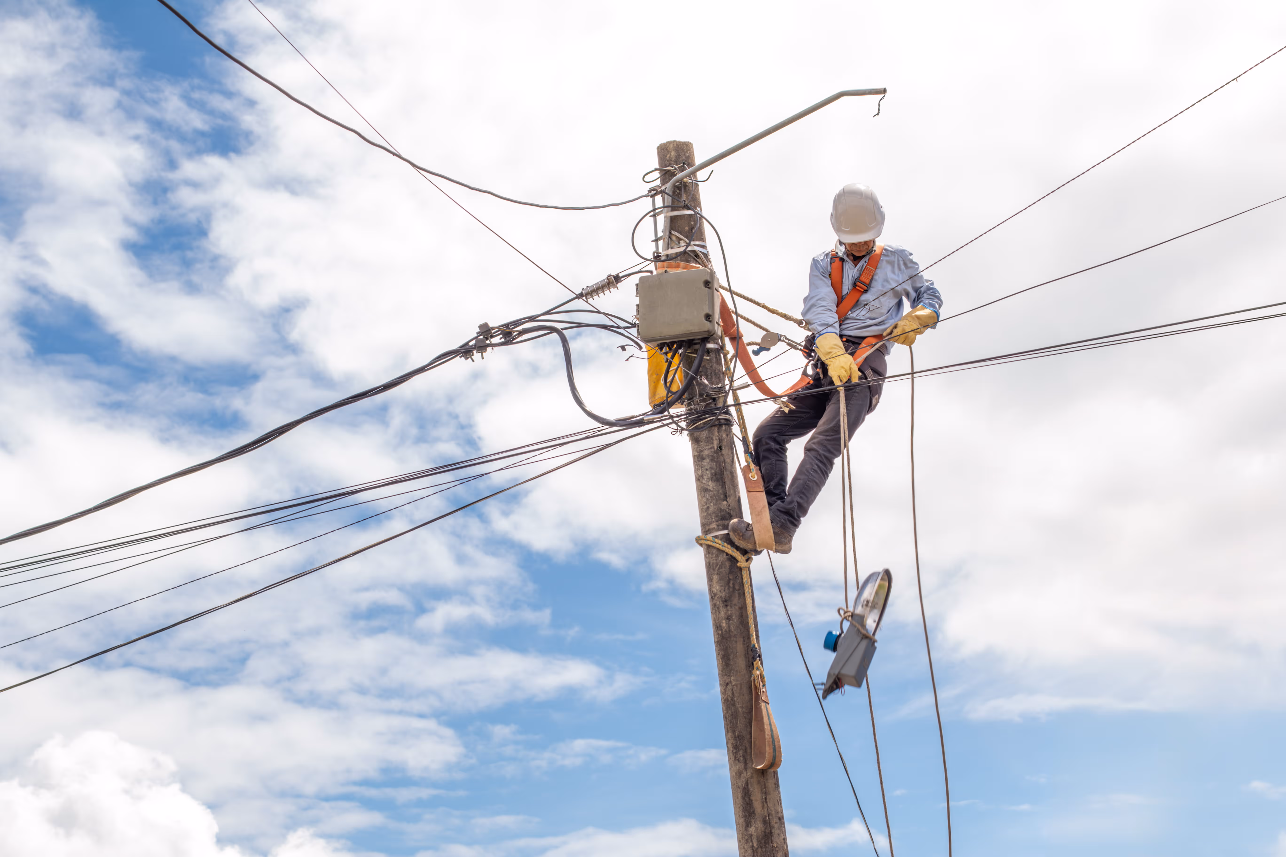 Man working on telephone pole
