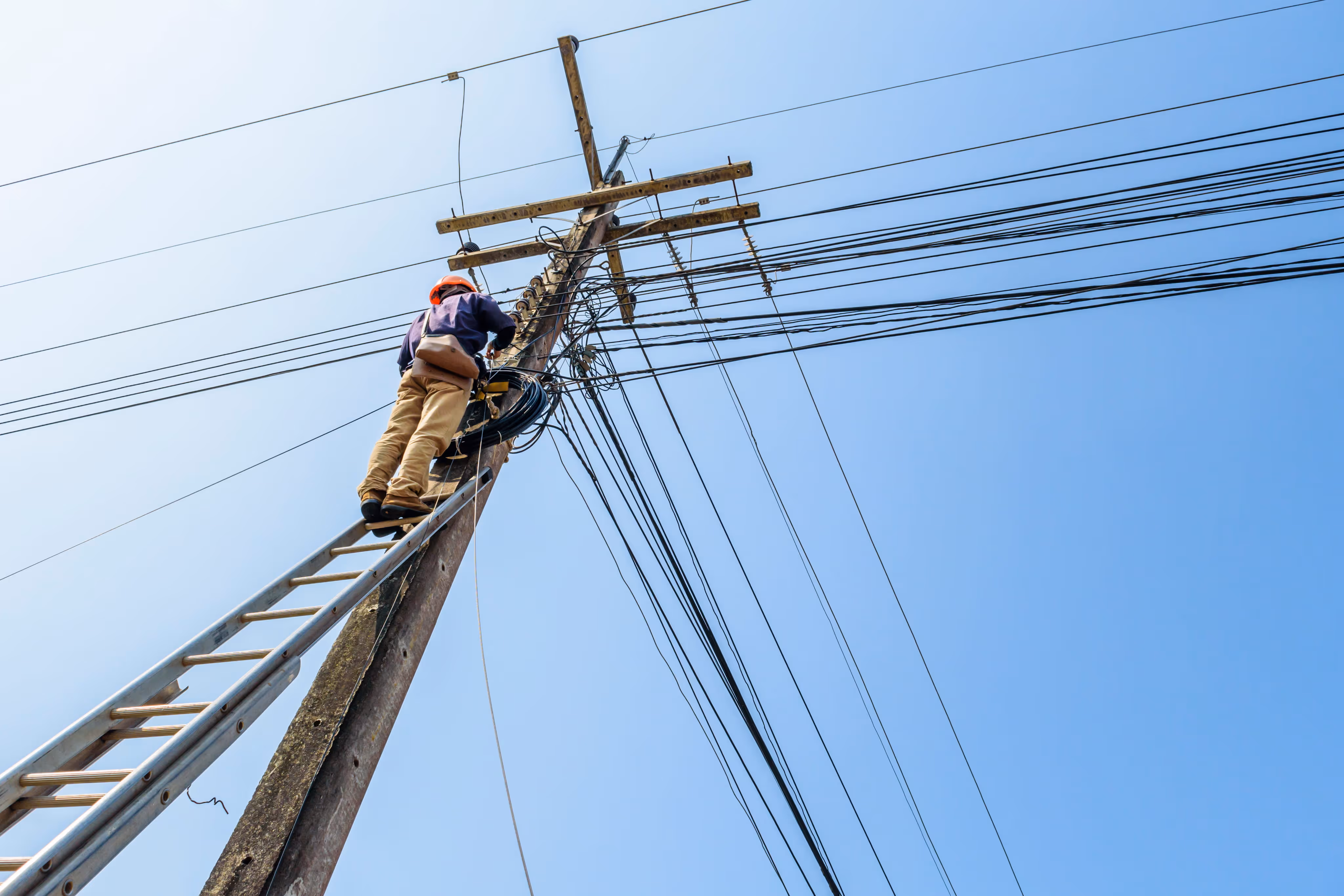 man working on telephone pole