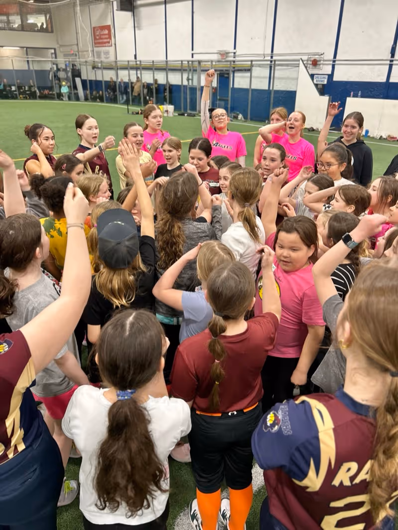 Team celebration with arms raised