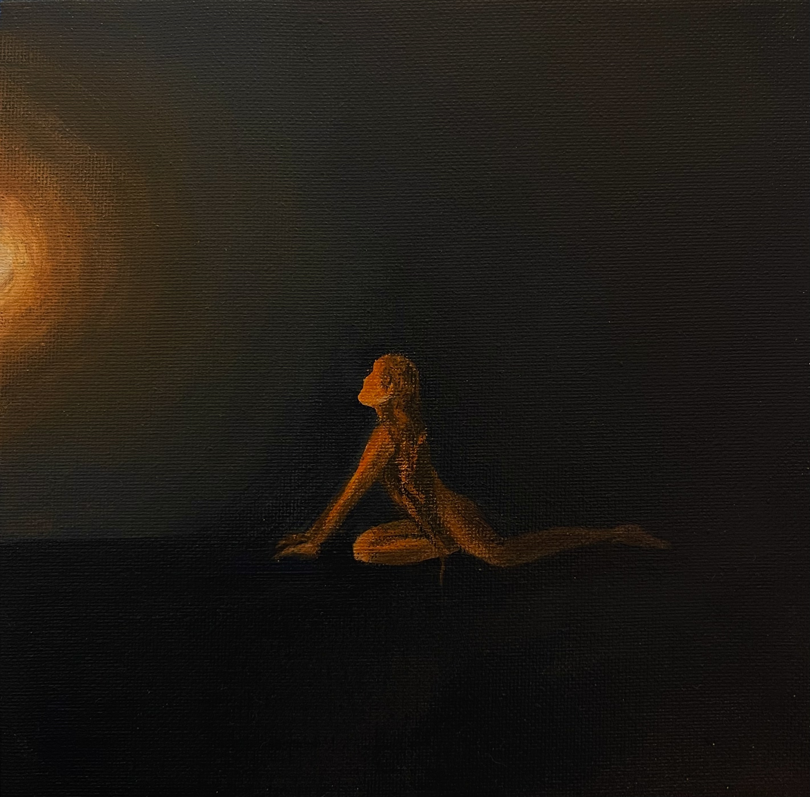 Silhouetted person with braided hair kneeling and stretching toward a bright warm light on a dark background.