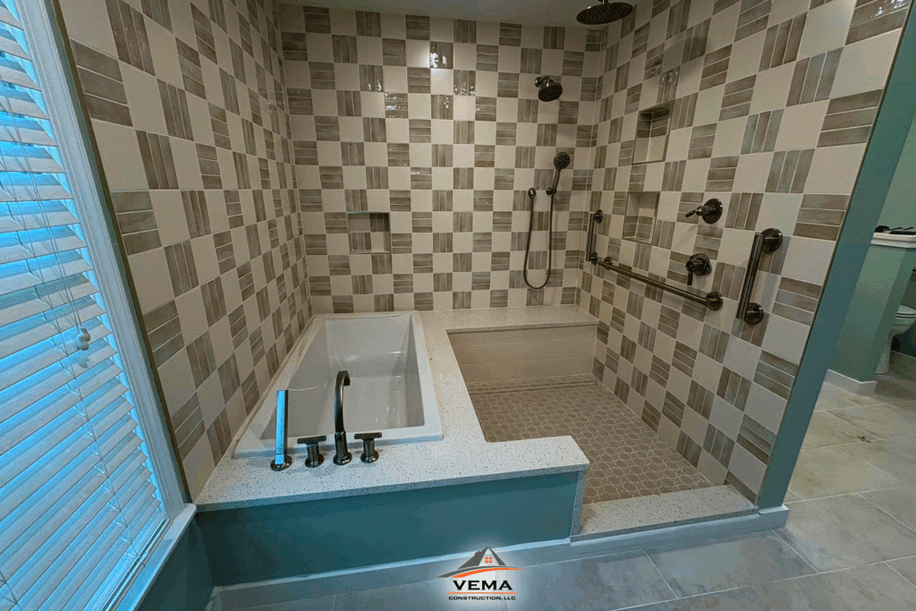 Modern bathroom with a built-in bathtub and walk-in shower with patterned beige and white tiles and grab bars.