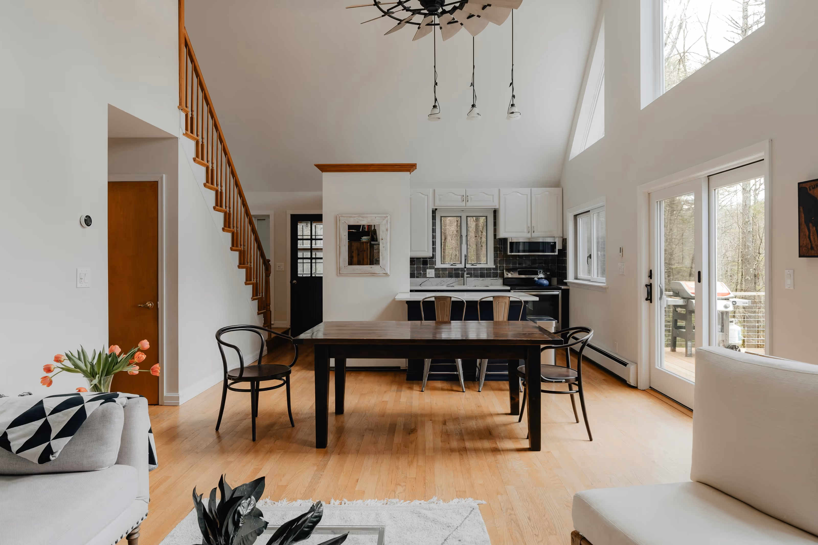 Bright, modern custom home interior featuring a dining area and vaulted ceilings, illustrating TrueSpan Group’s high-value homeowners insurance and asset protection.
