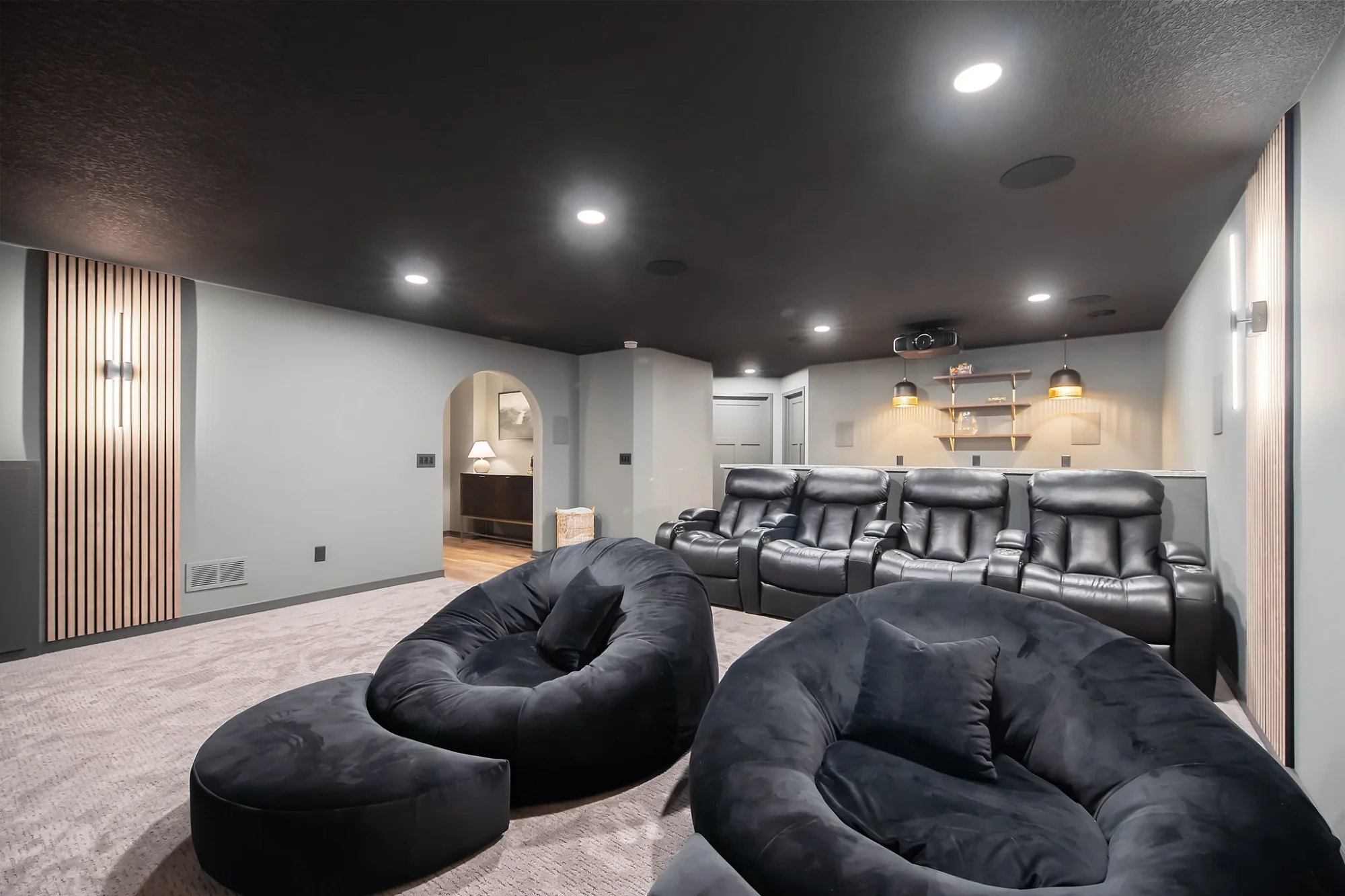 Basement lounge with sectional sofa and bar