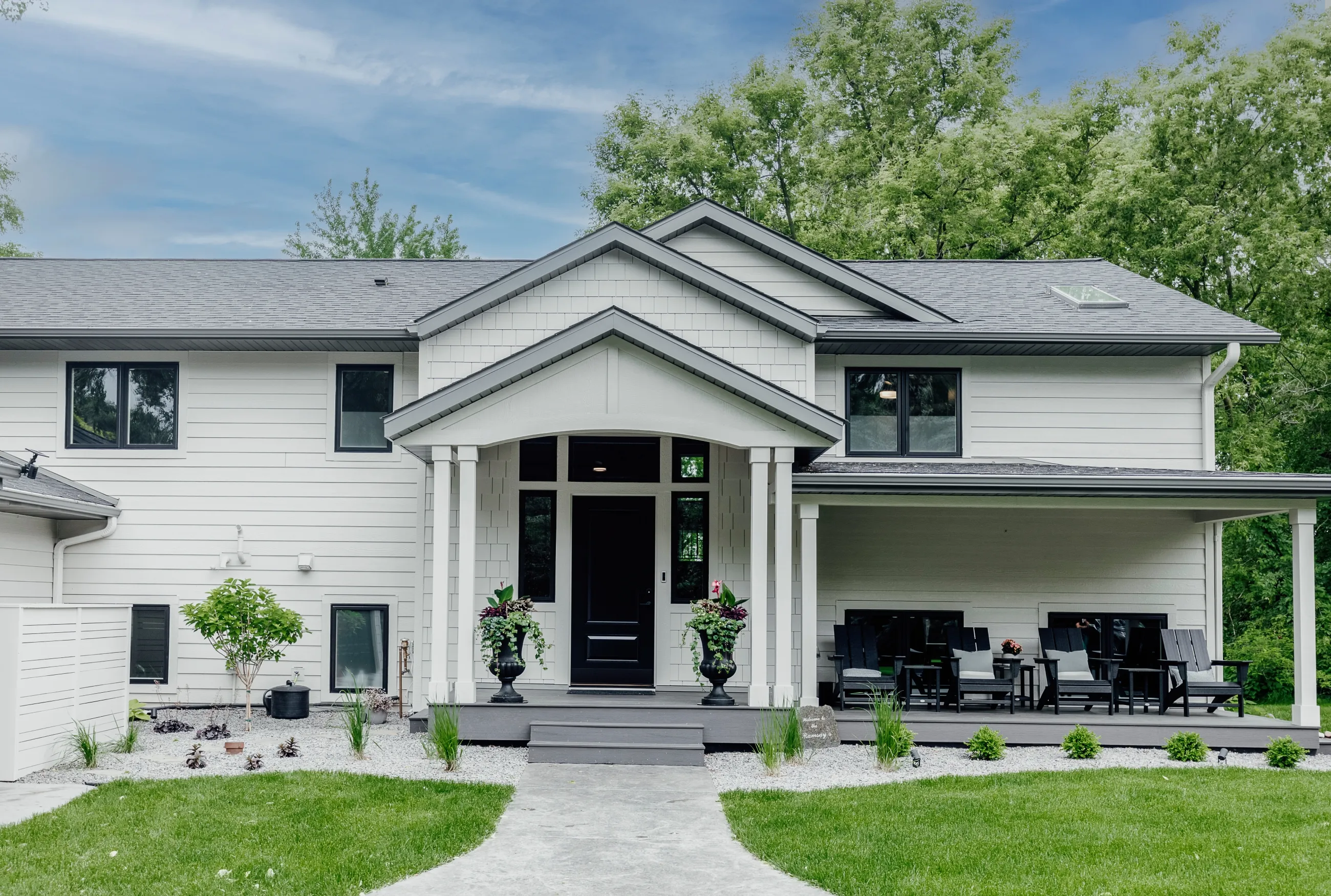 Front view of modern white house with covered porch