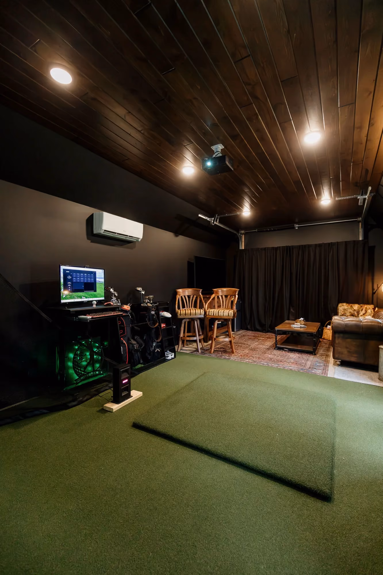 Home theater with projector screen and tiered seating