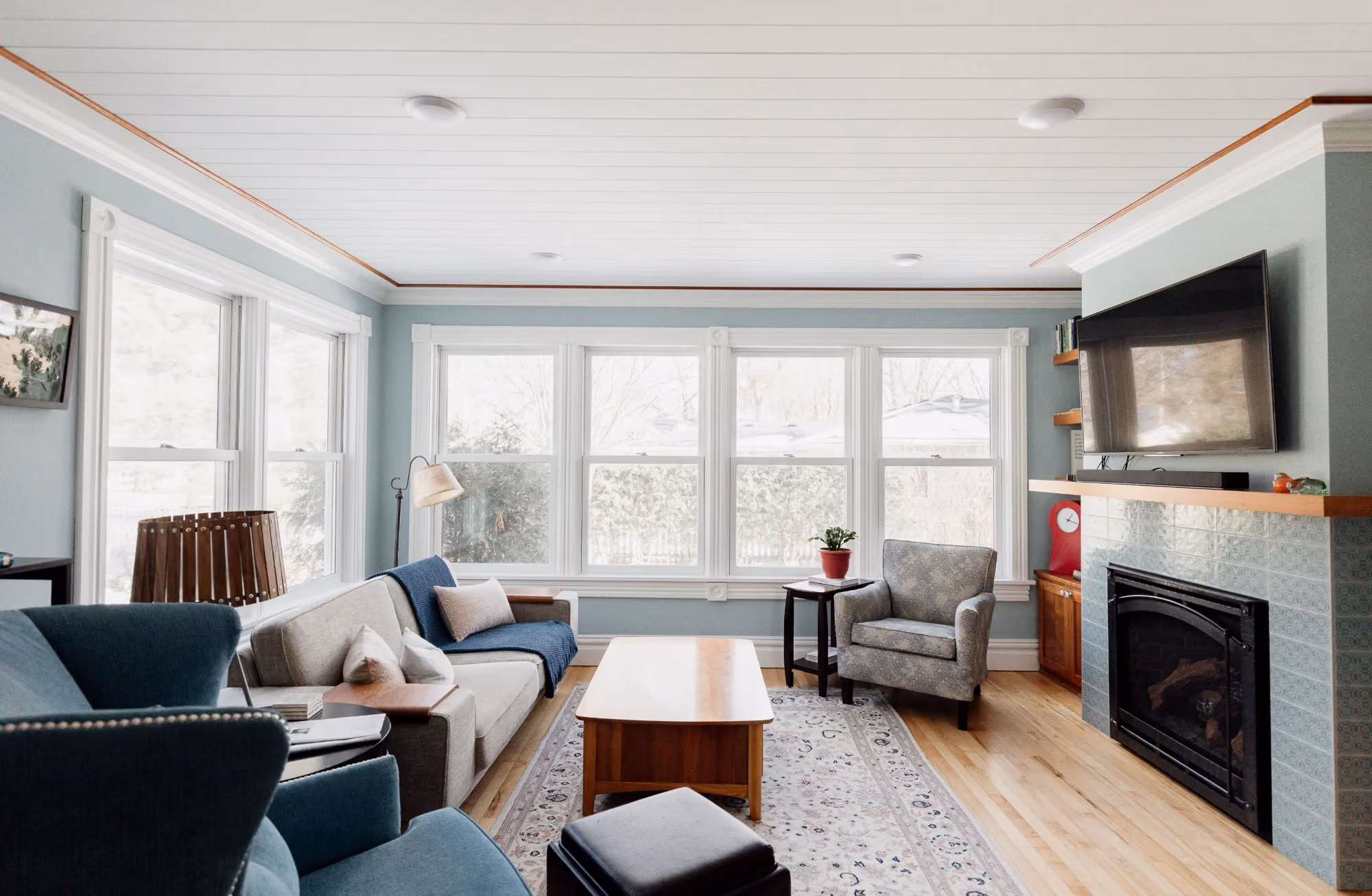 Bright living room with fireplace and seating area