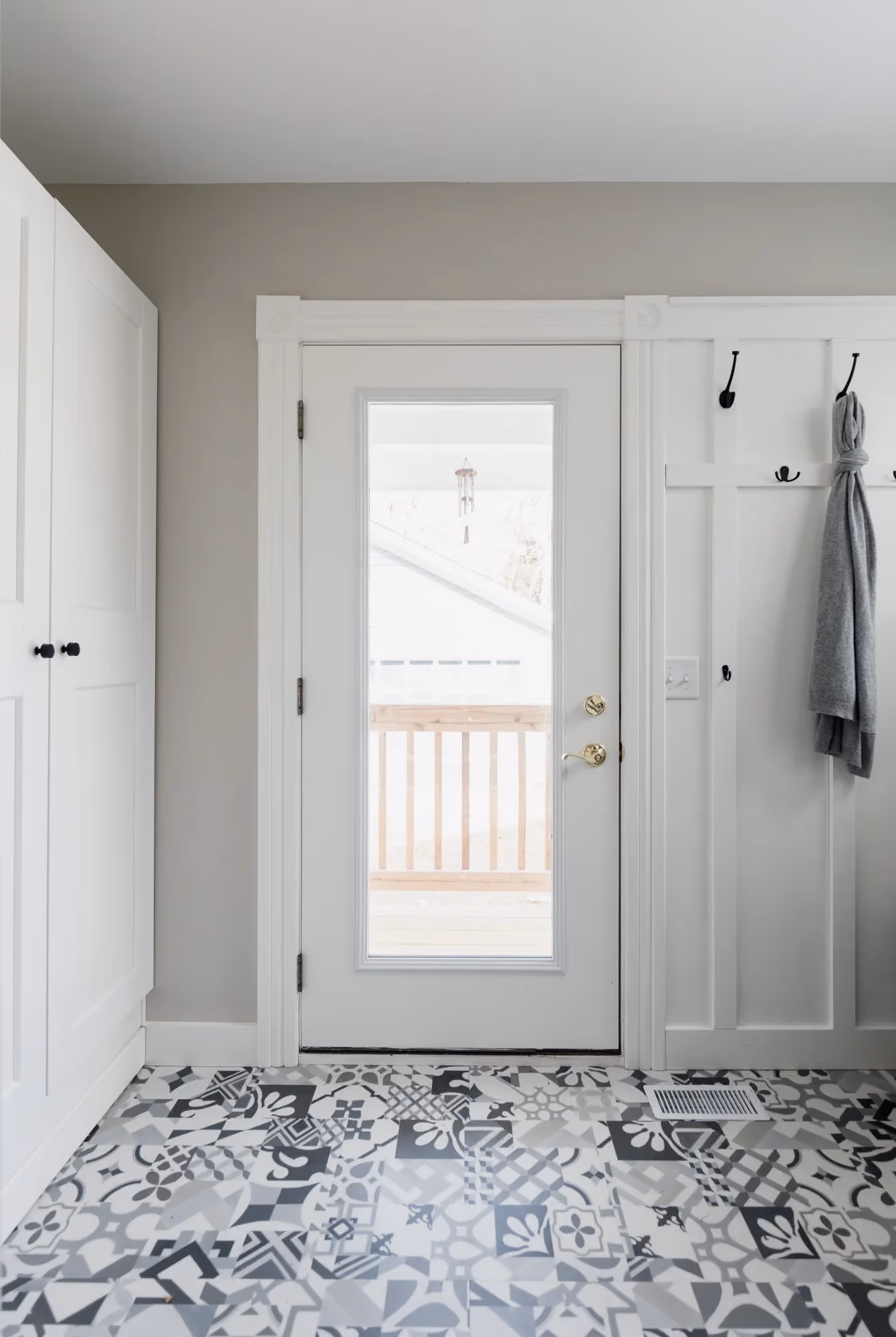 Small entryway with white front door