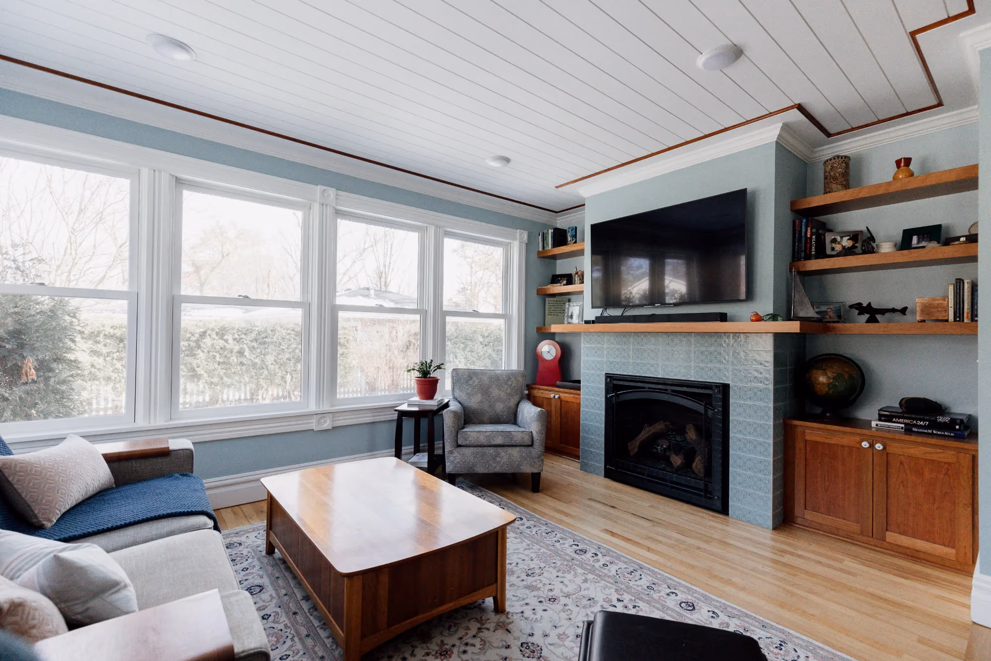 Living room with fireplace and large windows