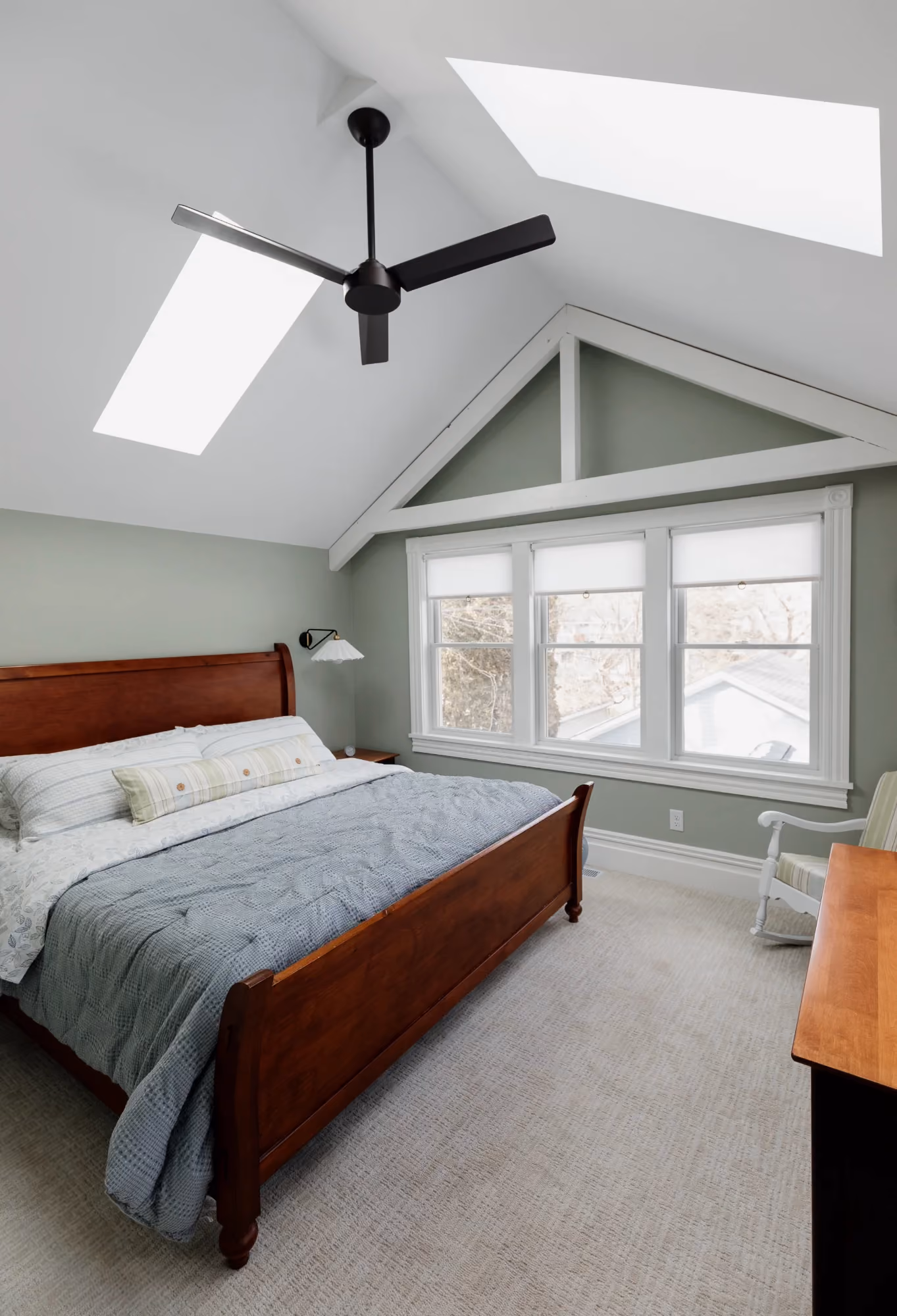 Bedroom with ceiling fan and windows