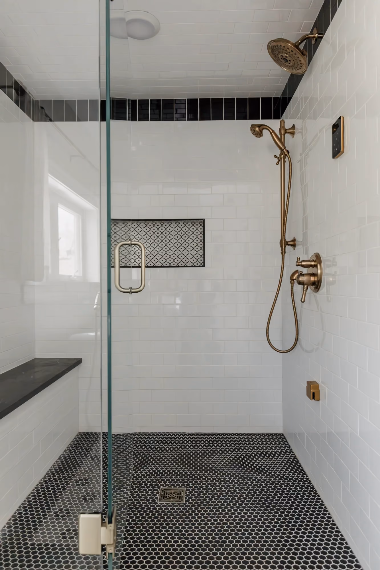 Walk-in shower with gray tile floor
