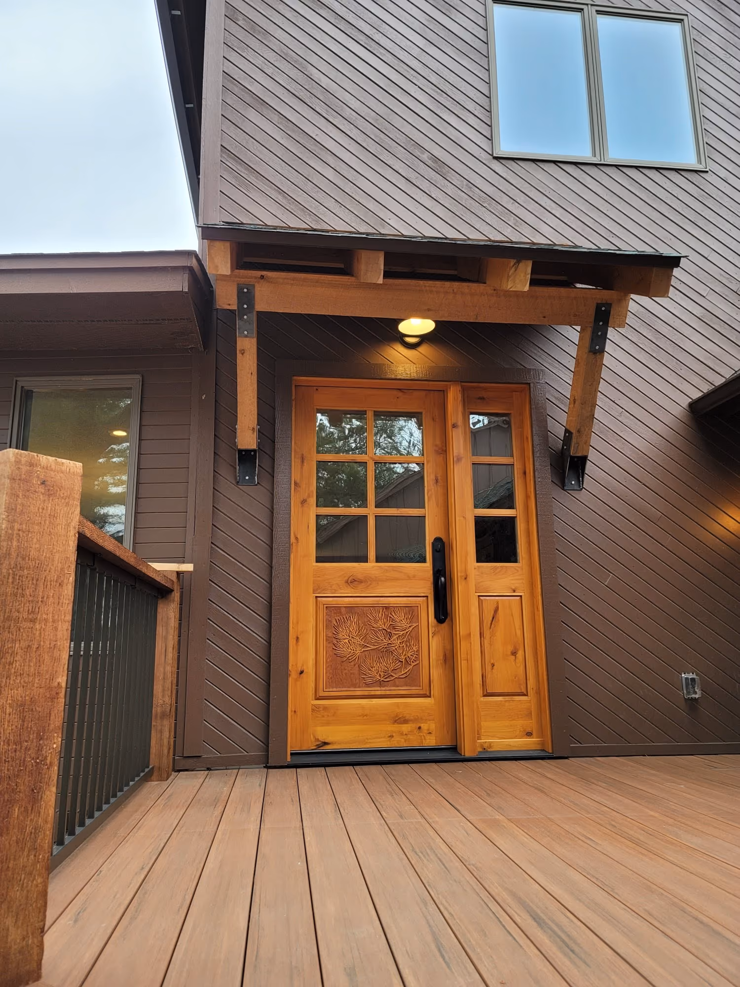 Front door and entry porch with deck flooring