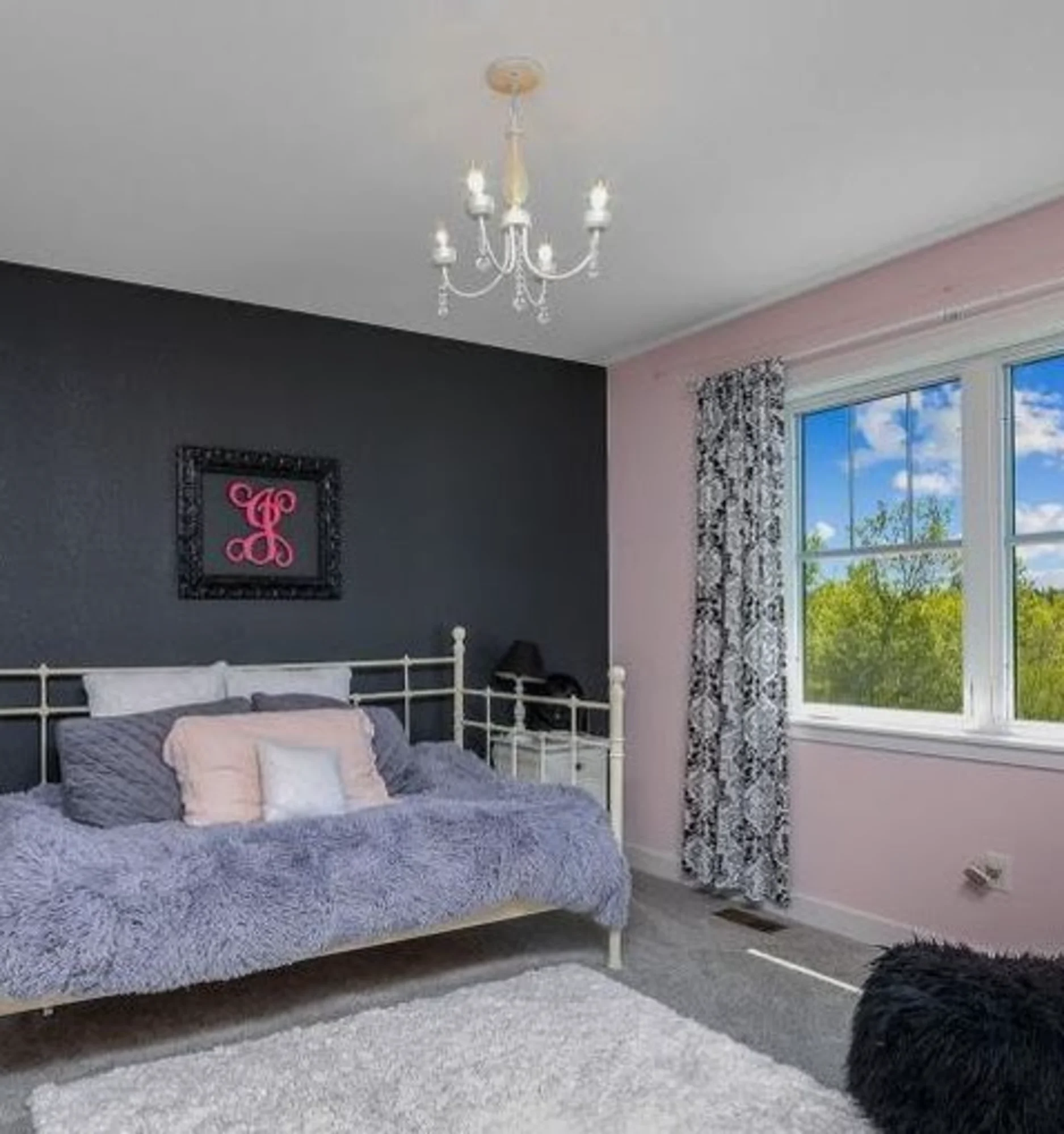 Bedroom with gray bed and ceiling fan