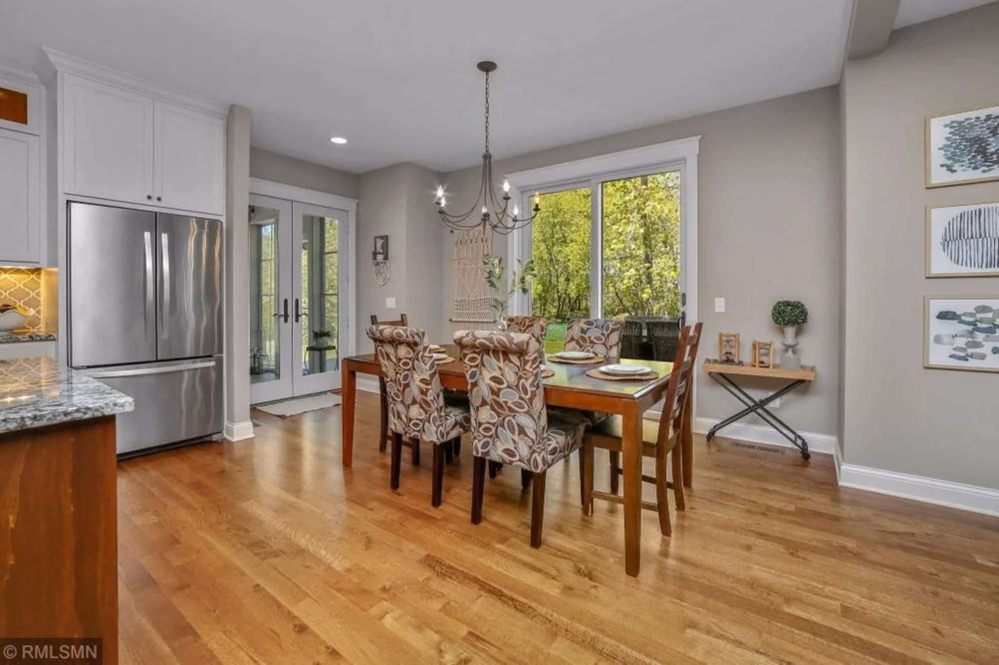 Dining area with wooden table and hardwood floors