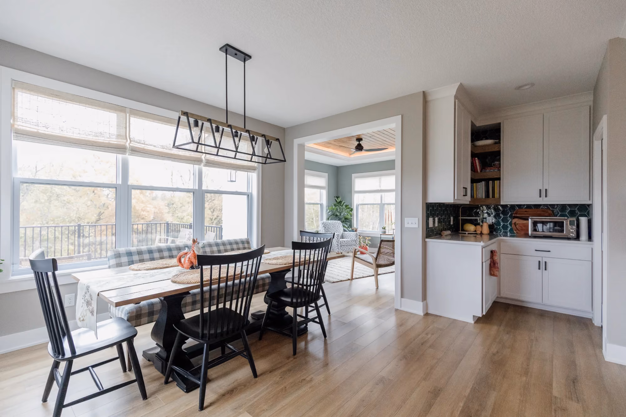 Open kitchen and dining area with island and windows