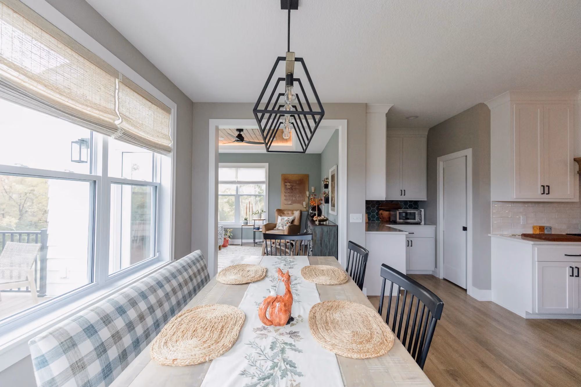 Bright dining room with long table and large windows