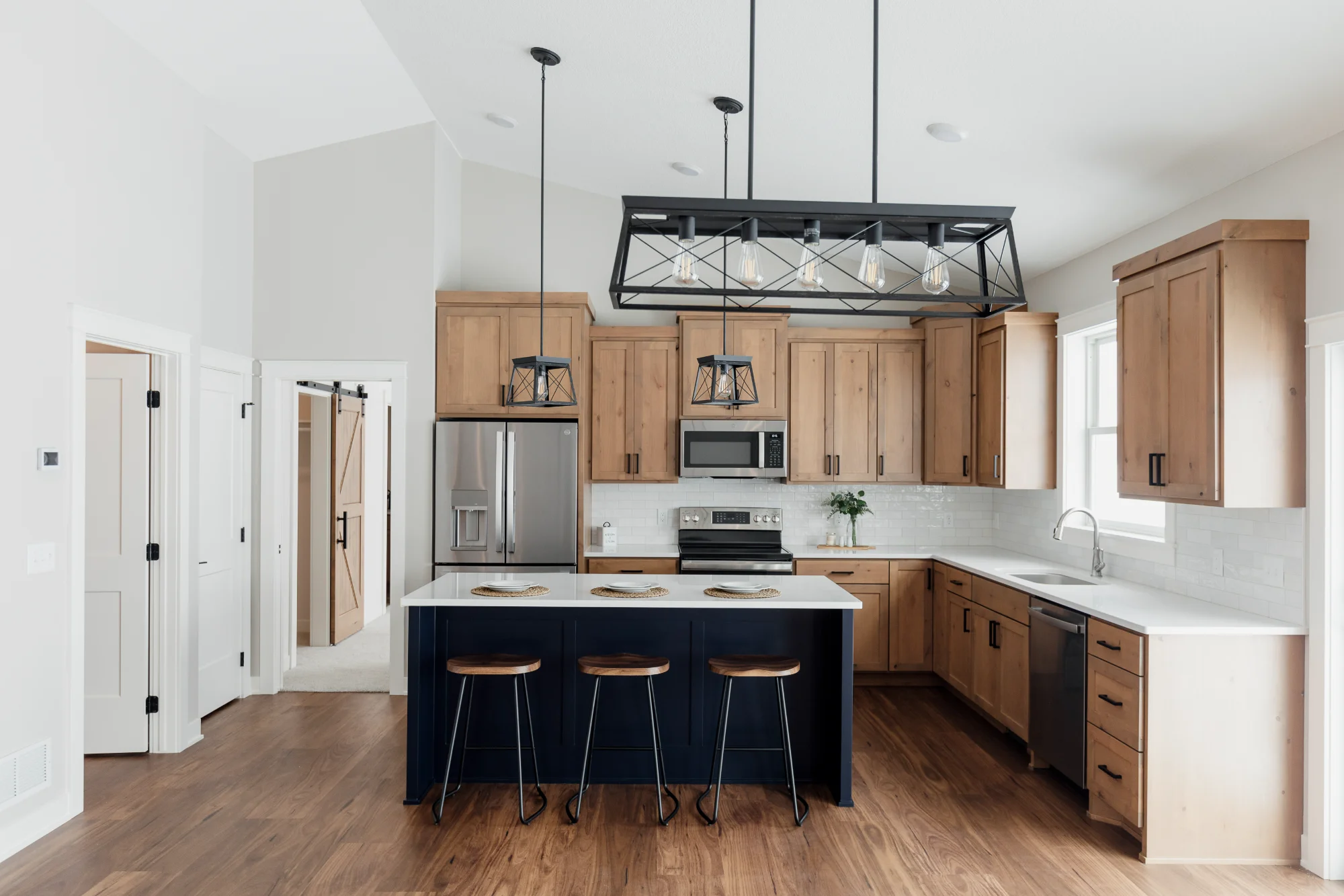 Modern kitchen with island and bar stools - 4