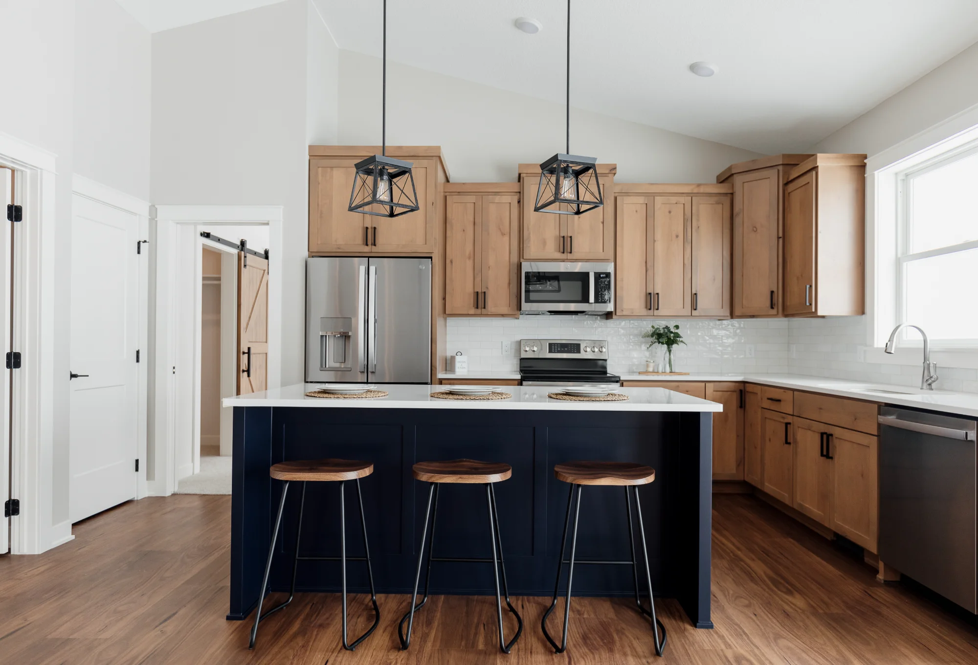 Modern kitchen with island and bar stools - 3