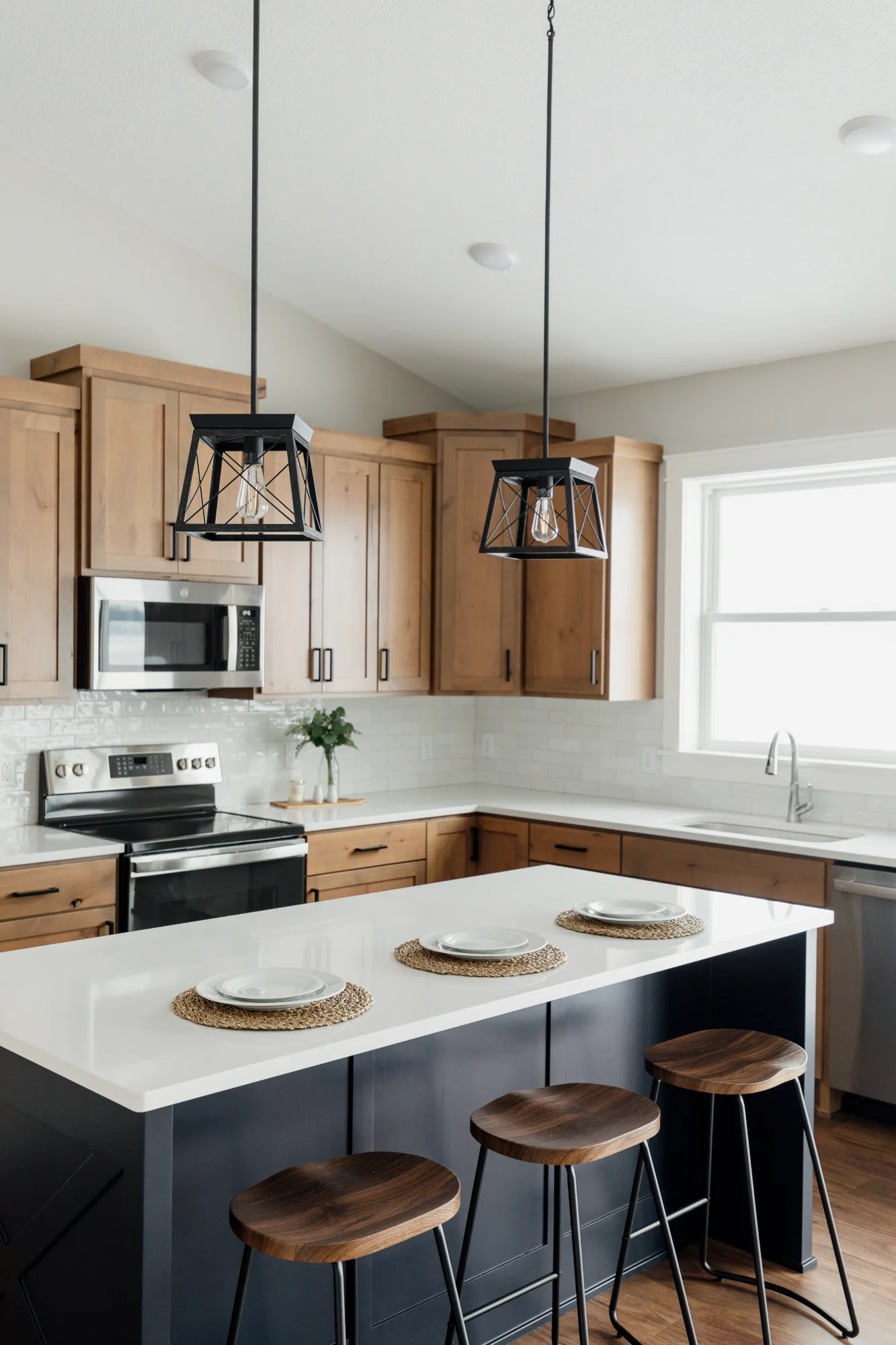 Kitchen island and dining area with pendant lights