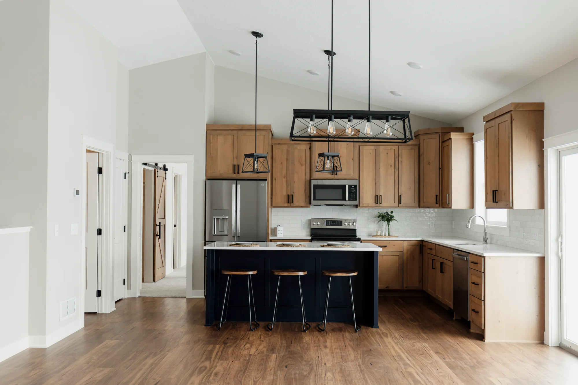 Bright kitchen with island and pendant lights