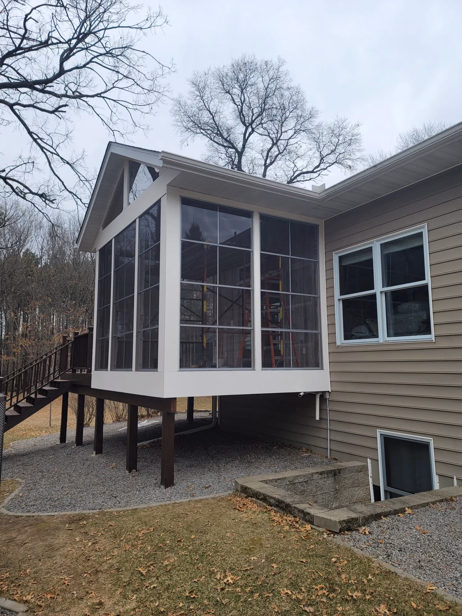 Side exterior view of house with deck and stairs