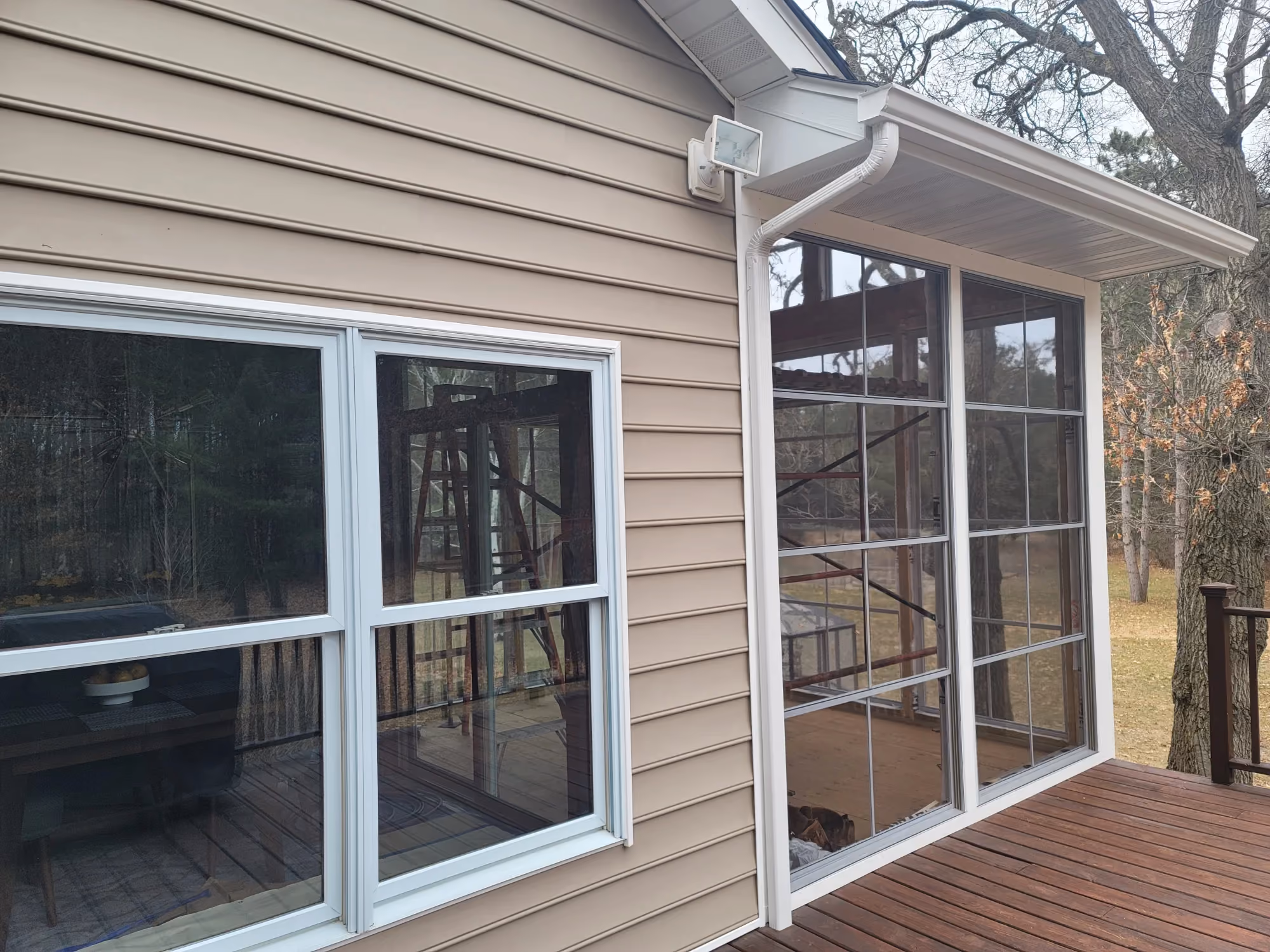 Close-up of exterior siding with window and porch
